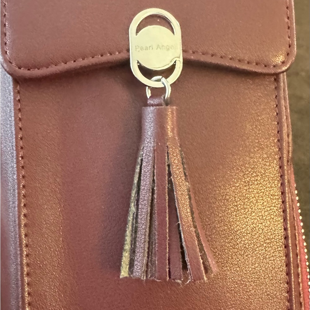 Burgundy Faux Leather Tassel Wristlet/Crossbody purse.